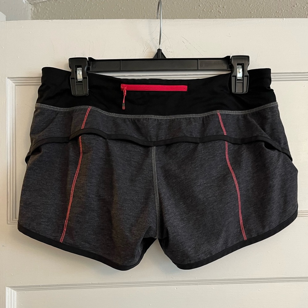 Lululemon speed up short gray with pink stitching and pockets size 6